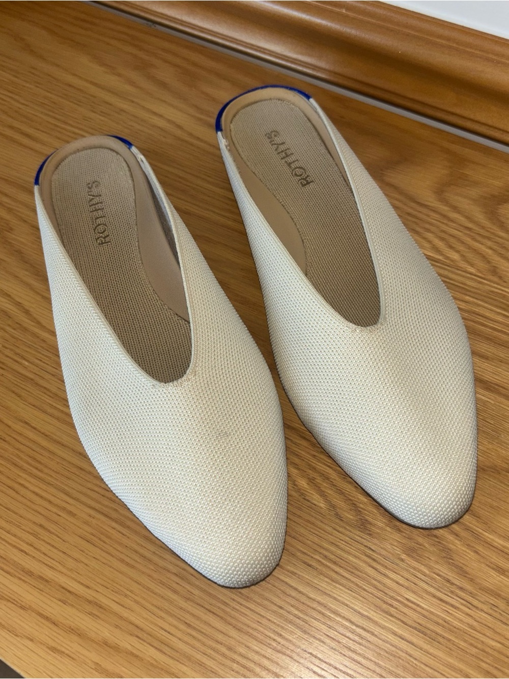 Rothy's Cream Slip-On Mules with Subtle Blue Trim